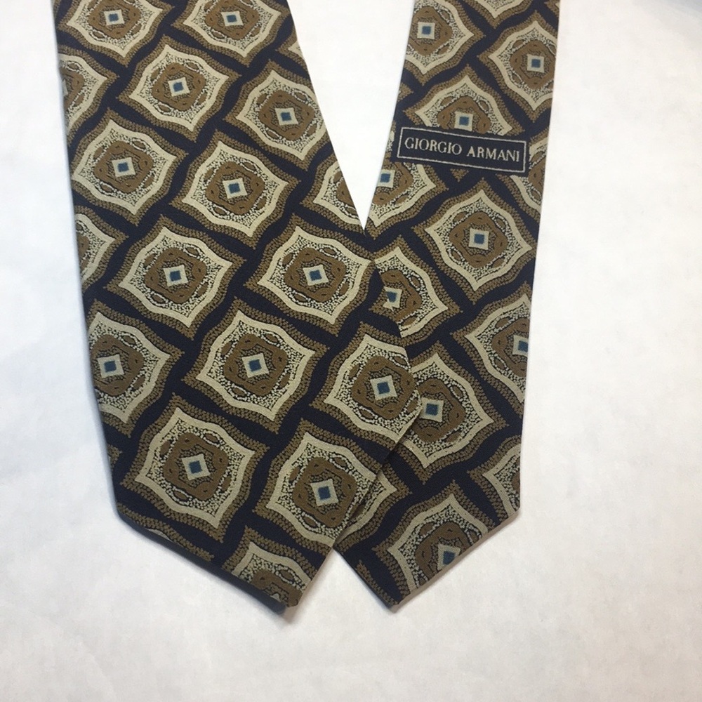 Giorgio Armani Caratte dark blue with antique gold & beige stylized pattern tie.
